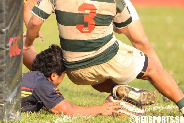 Ahmad Zhuri (ACS #13) stretching to just put the ball barely across the white line, the try proved to be the winning 