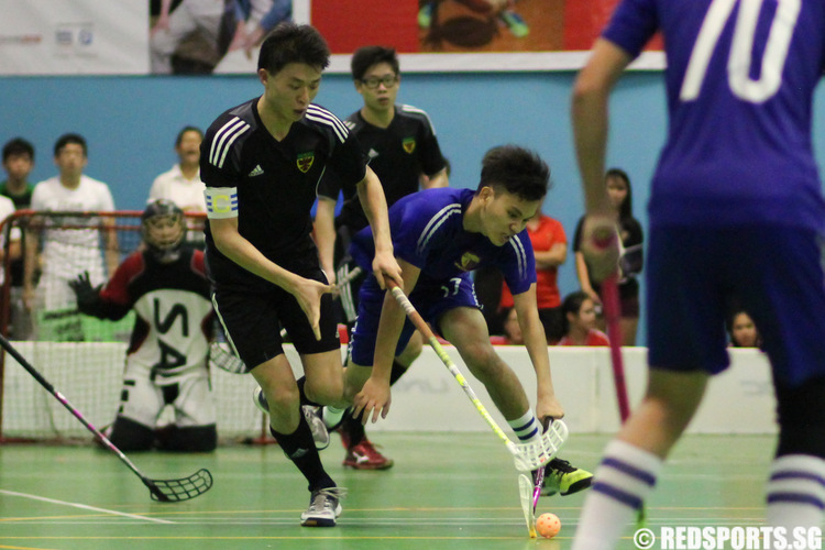 Benjamin Kristano (ACJC #97) controls the ball against Zhang Zhen Ming (RI #9).