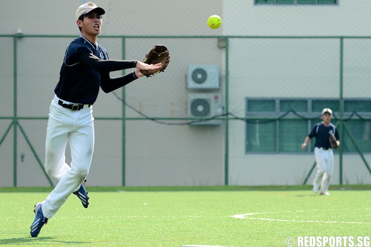 David (ACSI #13) throws the ball to first base. (Photo 10 © Matthew Lau/Red Sports)