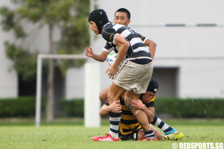 An ACS(I) player attempts to tackle (SAJC #13).