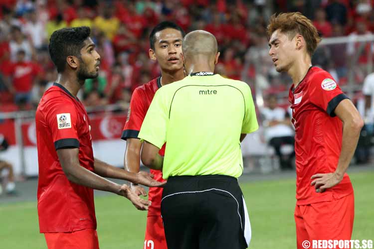 Singapore players still in disbelief of the penalty awarded to Malaysia.