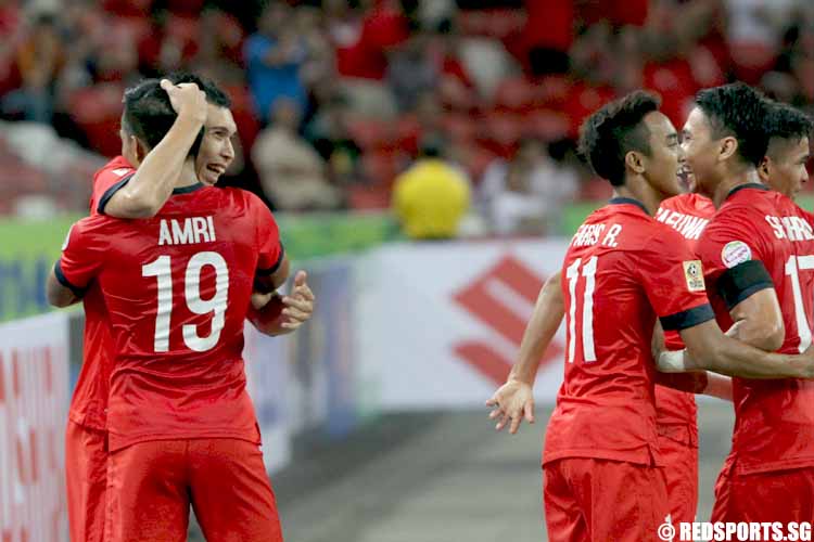 Shaiful Esah (#3) embracing Khairul Amri (#19) after scoring the first goal for Singapore. 