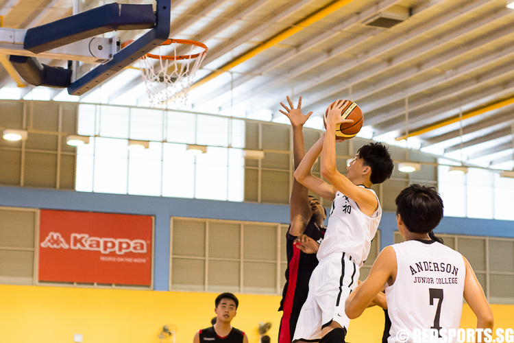 AJC (#11) attempts to shoot, while Siddhart (ACS(I) #12) guards him. (Photo 6 © Zachary Foo)