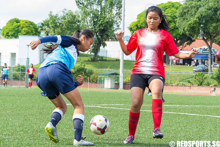 A Bowen player completely loses her defender with neat footwork and attempts to cross the ball into the penalty area. (Photo 3 © Zachary Foo/Red Sports)