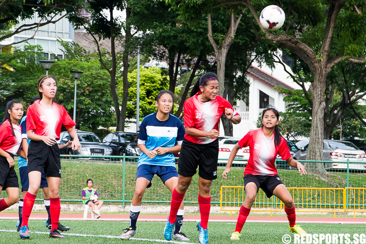 Nur Izzati (QSS #13) heads the ball away to safety. (Photo 4 © Zachary Foo/Red Sports)