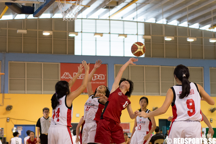 Lin Yuan (HCI #13) tips a rebound back to her teammates. She paced her team with 12 points. (Photo 3 © Zachary Foo/Red Sports)