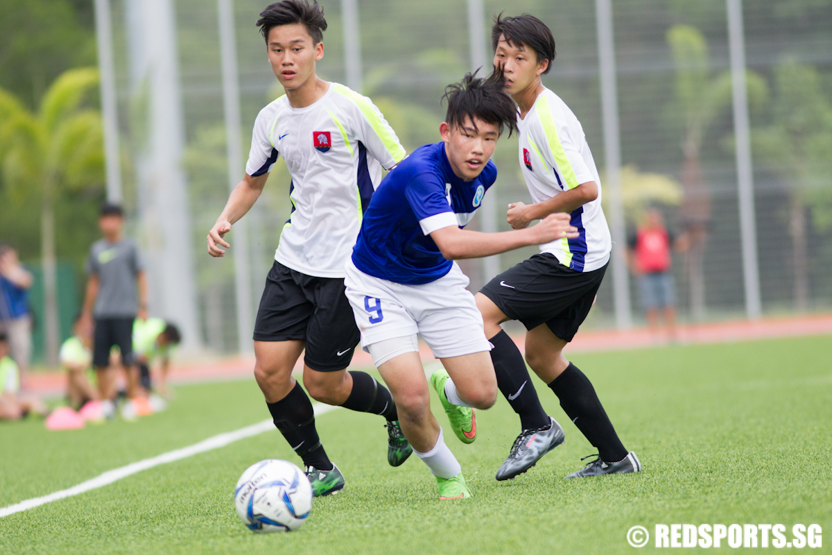 Royston Tan (#9) of Meridian Junior College goes against Nanyang Junior College's defence. (Photo © Lee Jian Wei/Red Sports)