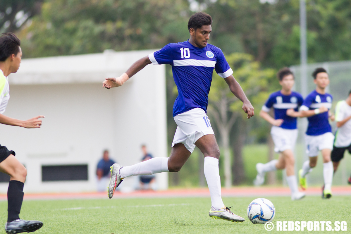 Mohamed Faizal (#10) of Meridian Junior College dribbles the ball against Nanyang Junior College. (Photo © Lee Jian Wei/Red Sports)