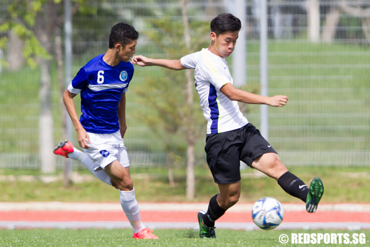 Jonathan Lim (#10) of Nanyang Junior College dribbles the ball against Syahidul Matin (#6) of Meridian Junior College. (Photo © Lee Jian Wei/Red Sports)