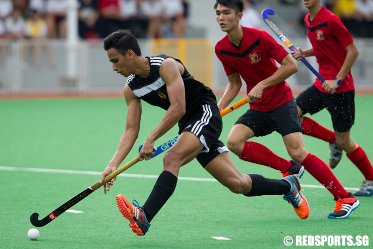 Jatinder Singh Kler (#14) of Raffles Institution dribbles against Anglo-Chinese Junior College. (Photo © Lee Jian Wei/Red Sports)