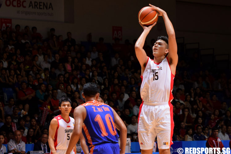 Russel Low (SIN #15) shoots a three-pointer. Russel contributed a game -high 17 points in his team's 131-33 win over Myanmar. (Photo 3 © Laura Lee/Red Sports)