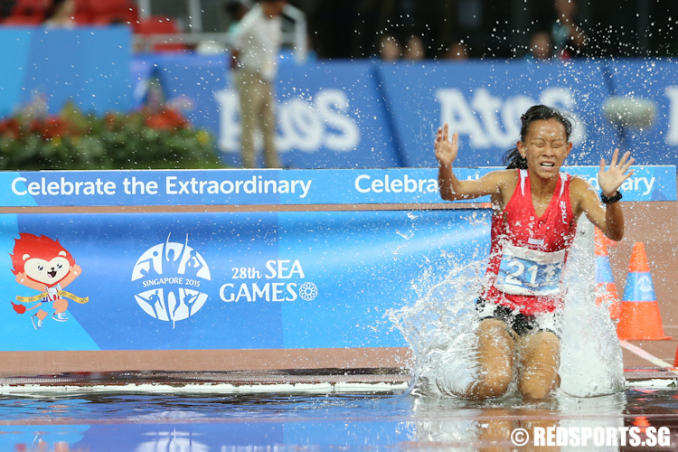 Eliza Ng of Singapore in action during the Women's 3000m Steeplechase. She clocked a personal best time of 12 minutes and 14.91 seconds to finish eight. (Photo © Lee Jian Wei/Red Sports)