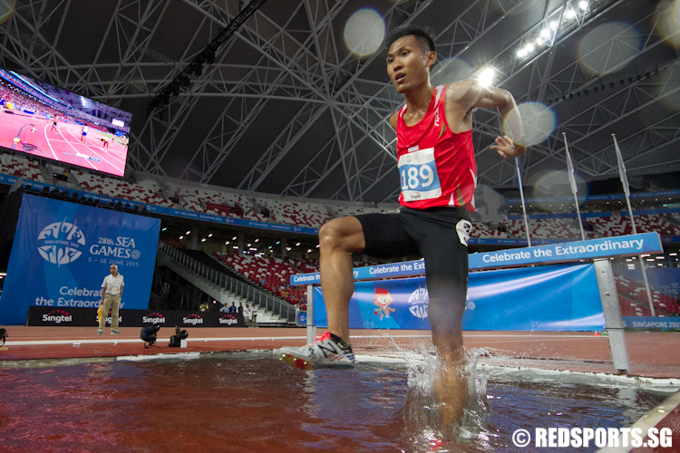 Colin Tung of Singapore in action during the Men's 3000m Steeplechase. He clocked a personal best of 9 minutes and 54.76 seconds to come in 11th. (Photo © Lee Jian Wei/Red Sports)