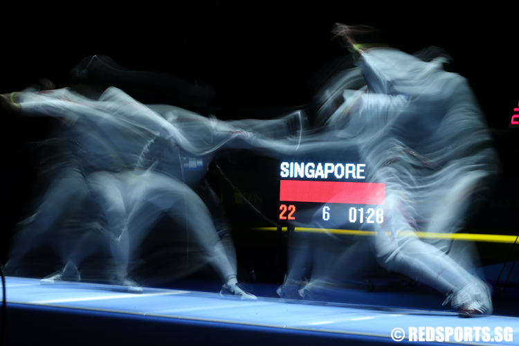Rania Herlina Rahrdja (SIN) in action against Herlene Raguin (PHI). (Photo © Lee Jian Wei/Red Sports)