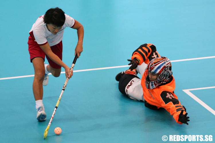 Jill Quek (#9) of Singapore scores a goal during the penalty shoot out. (Photo © Lee Jian Wei/Red Sports)