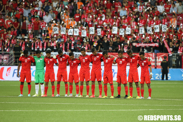 One minute of silence is observed before the match between Singapore and Cambodia at the Jalan Besar Stadium to pay tribute to the Sabah earthquake victims. (Photo © Lee Jian Wei/Red Sports)
