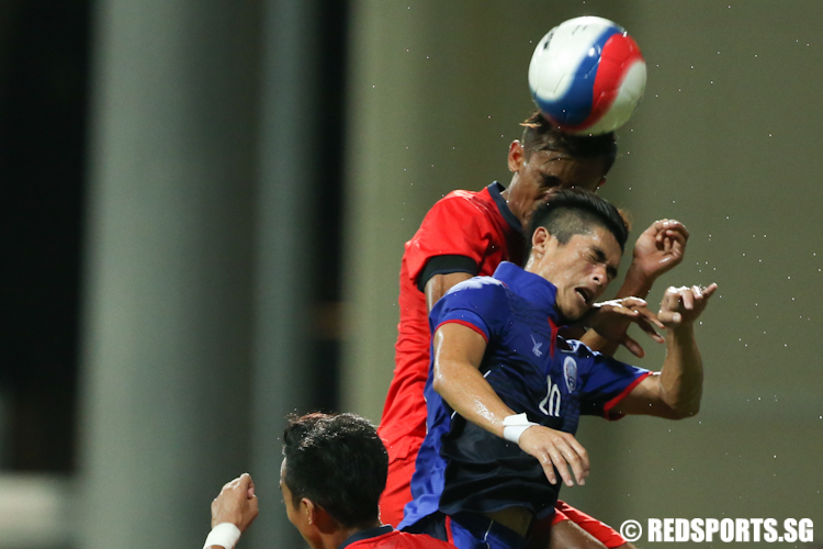 Shakir Hamzah (#2) of Singapore heads the ball away to safety. (Photo © Lee Jian Wei/Red Sports)