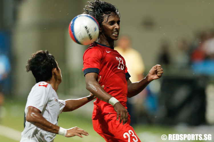 Suria Prakash (#23) of Singapore and Thura Shine (#20) of Myanmar fights for possession of the ball.  (Photo © Lee Jian Wei/Red Sports)