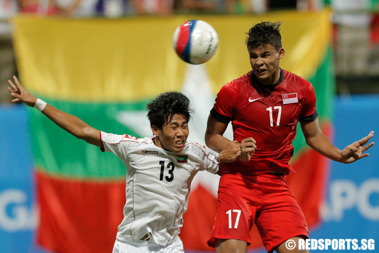 Irfan Fandi (#17) of Singapore goes against Hein Ko Ko (#13) of Myanmar. (Photo © Lee Jian Wei/Red Sports)