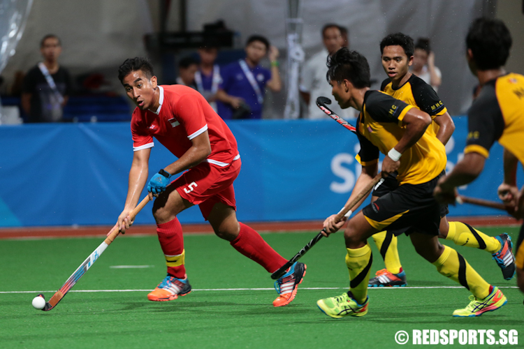 Enrico Marican (#5) of Singapore looks to pass the ball. (Photo © Lee Jian Wei/Red Sports)