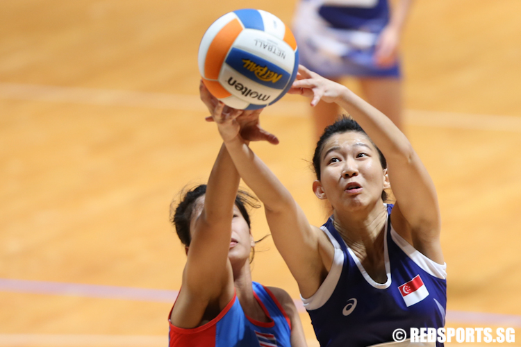Charmaine Soh (GS) of Singapore steals the rebound from Thailand. (Photo 4 © Lee Jian Wei/Red Sports)