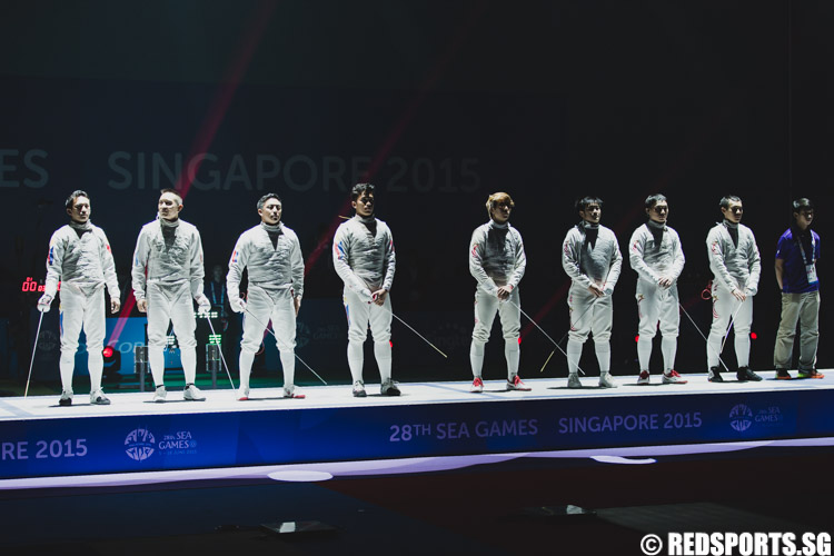 The Singapore and Philippines fencing team during the line-up. (Photo 8 © Soh Jun Wei/Red Sports)