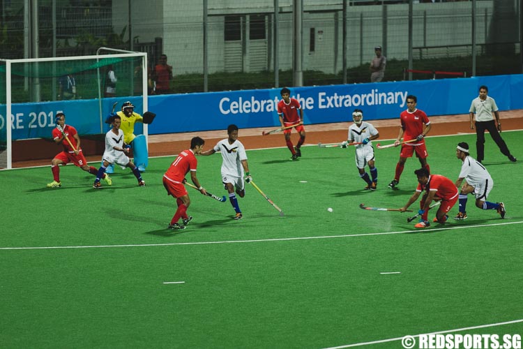 Enrico Elifh (SIN #5) attempts a shot after a penalty corner (Photo 7 © Soh Jun Wei/Red Sports)