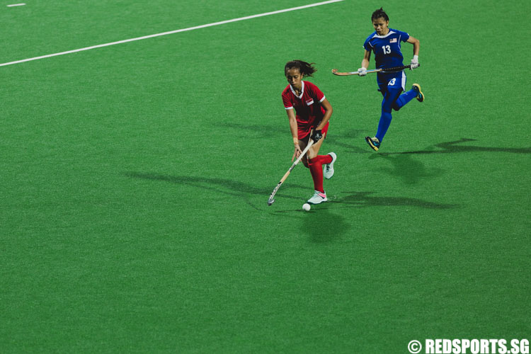 Jefri Nur Syaheeza (SIN #15) controls the ball against Mohd Arshad Noorain (MAS #13). (Photo 5 © Soh Jun Wei/Red Sports)