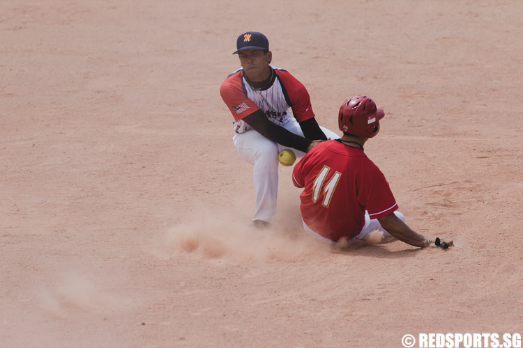 Ivan Ng Ee Han (SIN #11) slides into second base while Saiful Shahrin (MAS #7) is trying to tag him out. (Photo 8 © Soh Jun Wei/Red Sports)