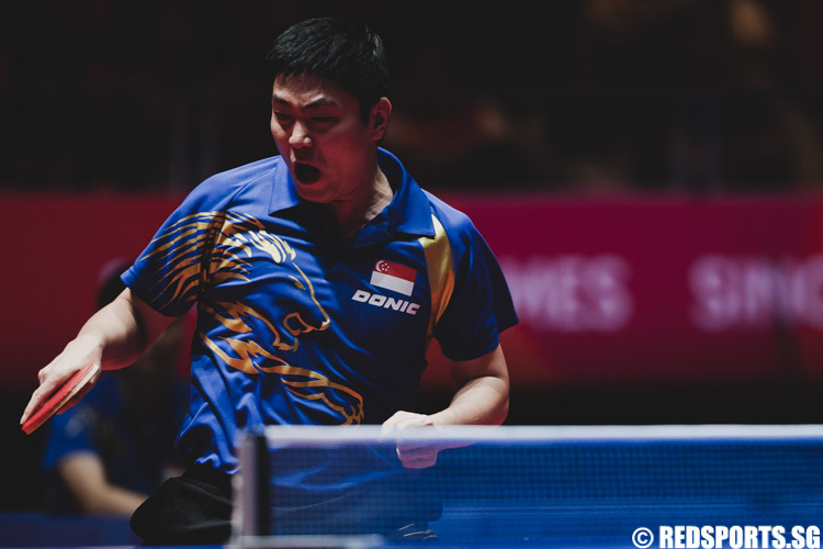 Gao Ning (SIN) lets out a roar after gaining a point against his Vietnamese opponent. (Photo 3 © Soh Jun Wei/Red Sports)