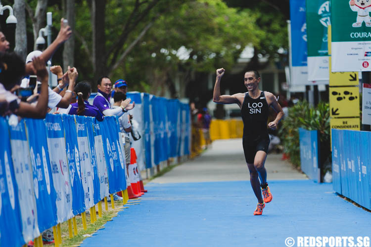 Wille Loo Chuan Rong (SIN) smiling as he appoaches the finishing line. (Photo 1 © Soh Jun Wei/Red Sports)