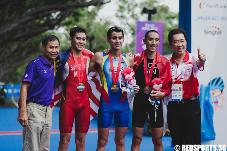 The medalists pose for a group photo on the podium. (Photo 17 © Soh Jun Wei/Red Sports)