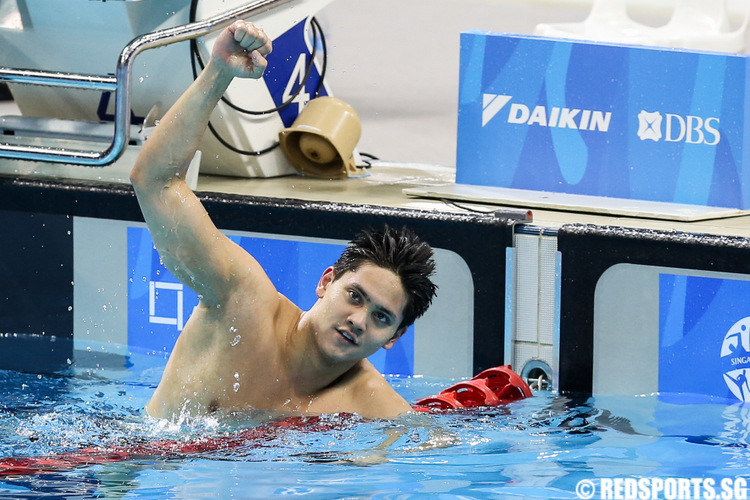 Joseph Schooling celebrating after setting a new games record in the 100m butterfly final. (Photo 1 © Matthew Lau/Red Sports)