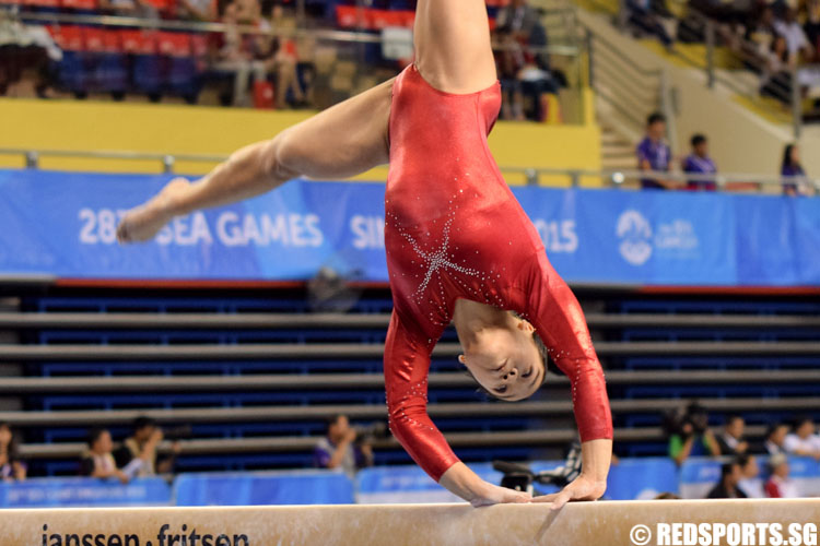 Ashley Lau executing a cartwheel as part of her dismount. (Photo 4 © Laura Lee/Red Sports)