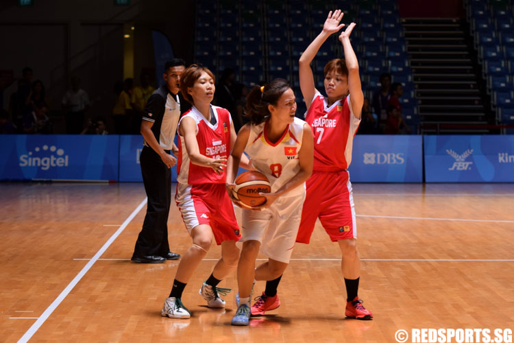 Huynh N (VIE #8) steals the ball from Yoshida Y (SIN #13). (Photo 2 © Laura Lee/Red Sports)