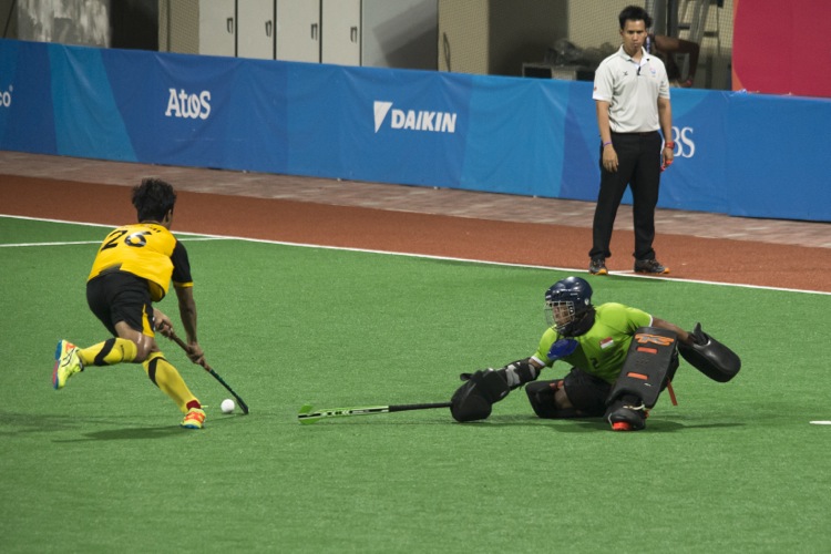 The unsung hero of the match is Singapore’s keeper Adon Nur Iszuan (#2) who valiantly wards off the Malaysian attacks at goal.