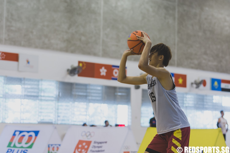 Yishun Secondary alumnus Leon Lee attempts a jump shot during the U-17 boys' 3 x 3 basketball competition of the Singapore Youth Olympic Festival. (Photo 20 © Soh Jun Wei/Red Sports)