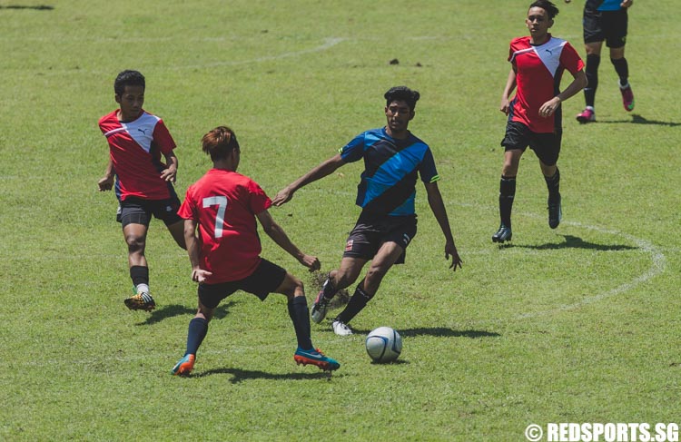 Darshan controls the ball during the preliminary round of the Football 7s at the Singapore Youth Olympic Festival. (Photo 9 © Soh Jun Wei/Red Sports)