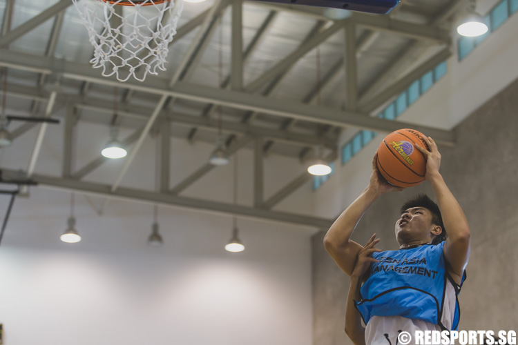 Chua Hao Jun of KaiXuan in action during the U-15 boys' 3 x 3 basketball competition of the Singapore Youth Olympic Festival. (Photo 23 © Soh Jun Wei/Red Sports)
