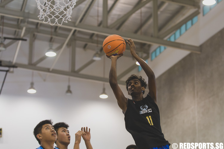 Vignesh Rengarajan of SKC attempting a lay-up during the U-17 boys' 3 x 3 basketball competition of the Singapore Youth Olympic Festival. (Photo 24 © Soh Jun Wei/Red Sports)