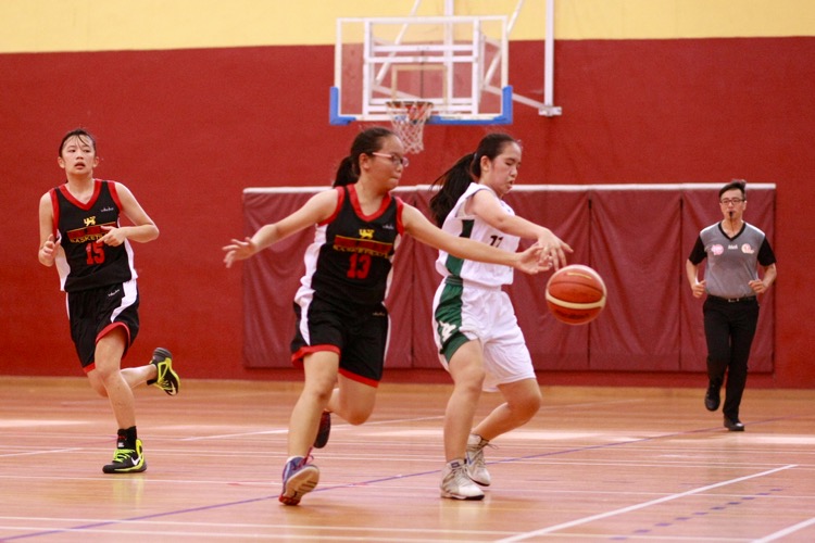 NJC #13 defends against the SMS #11. (Photo 3 © Les Tan/Red Sports)