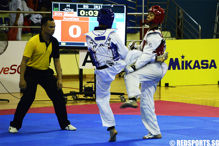 Taekwondo practitioners spar on the mat. (Photo 5 © Louisa Goh/Red Sports)