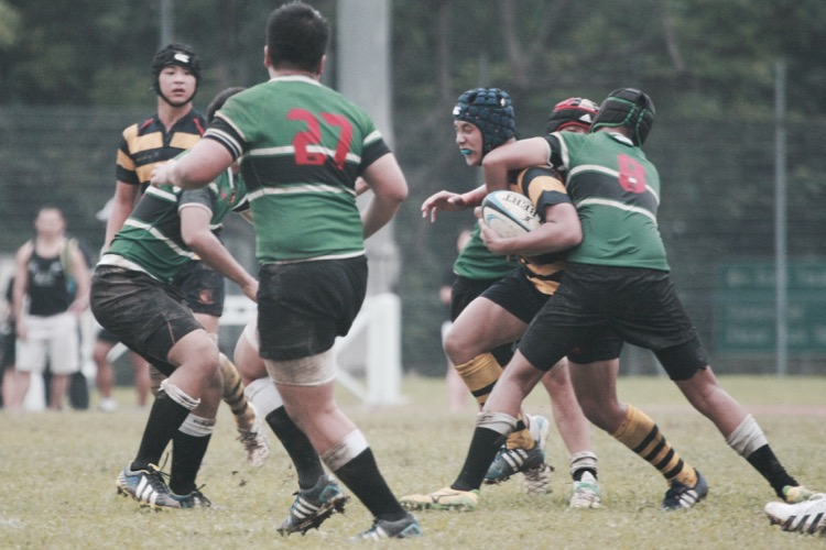 Elijah Ho gets tackled by (RI #8)  (Photo 7 © Les Tan/Red Sports)