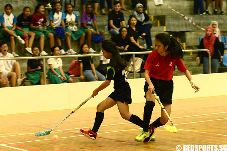 Sharifah Nadhrah (TK #25) handles the ball away from Caluza Denise Jazmine Carnate (#23). Sharifah added one goal to Tanjong Katong’s score. (Photo 5 © Louisa Goh/Red Sports)