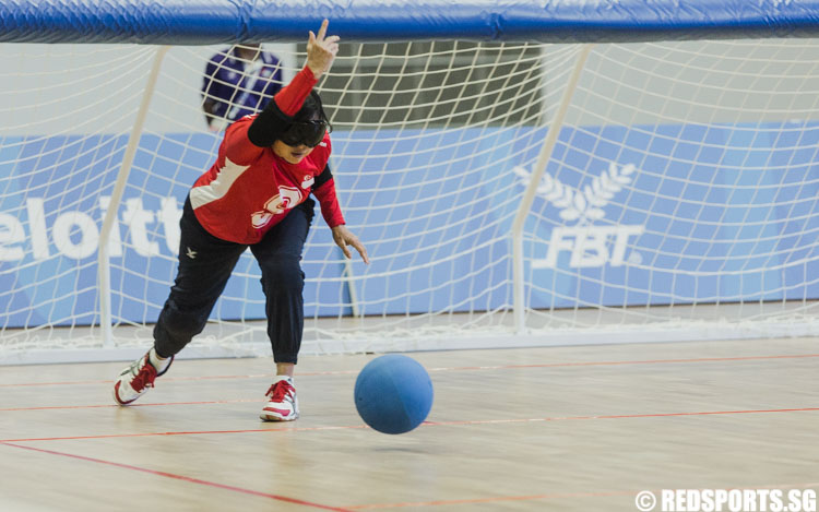 Grace Ng Mui Kheng (SIN #9) throws the ball during the 8th ASEAN Para Games Goalball Women 1st Preliminaries Round. (Photo 2 © Soh Jun Wei/Red Sports)