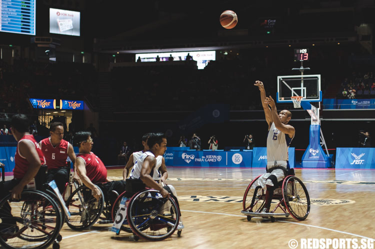 Aekkasit Jumjarean (THA #15) attempting a long 2-pointer during the wheelchair basketball match at the 8th ASEAN Para Games. (Photo 8 © Soh Jun Wei/Red Sports)