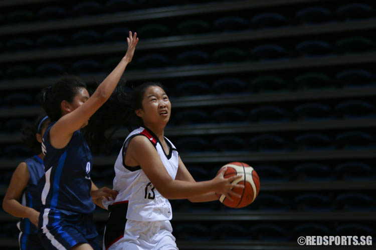 Fang Hui Hui (St Margarets’ #13) aims for a shot despite tight defence. (Photo 5 © REDintern Chua Kai Yun)
