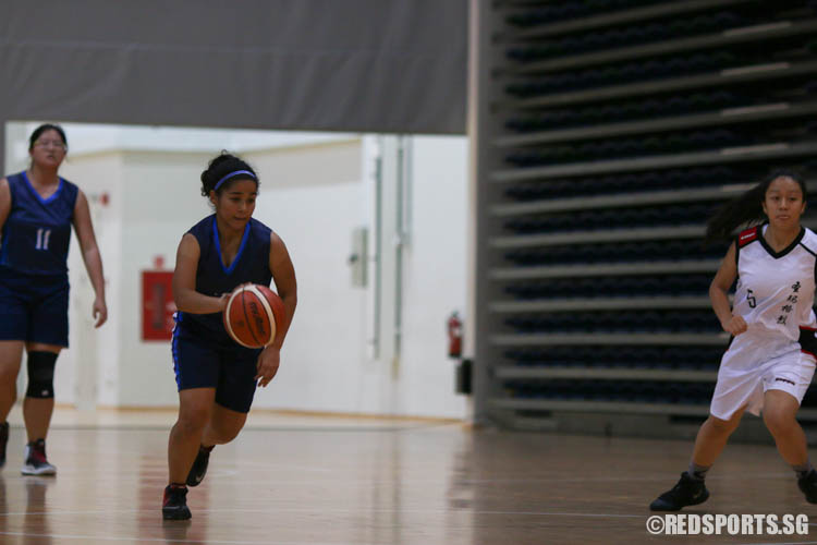 Tania Abraham (CHIJ #28) dribbles across the court. (Photo 6 © REDintern Chua Kai Yun)