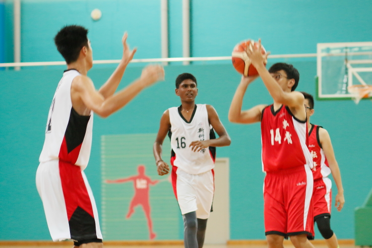 Jun Jie (Yuan Ching #14) pulling up for a jumpshot over the SST defense.
