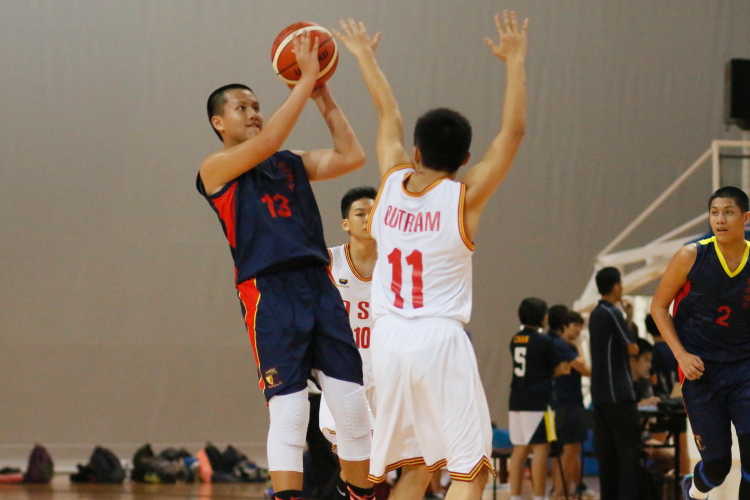 Yue Hent (ACS Barker#13) takes a fadeaway jumpshot over Kian Xin (Outram #11).